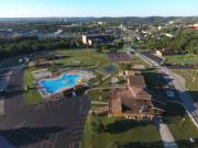 Aerial view of entrance to Treasure Lake showing outdoor pool, Clubhouse, Welcome Ctr.